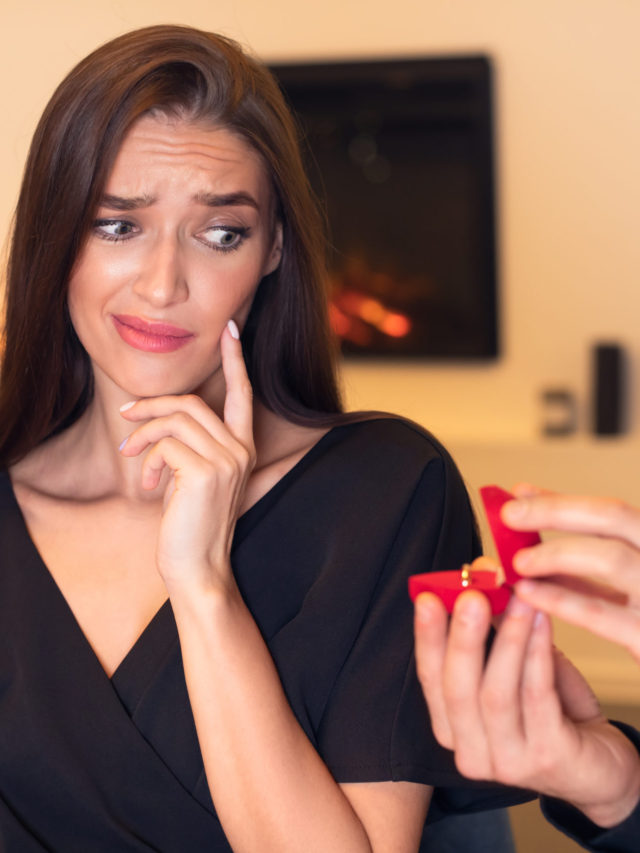 Man making proposal with ring, woman rejecting